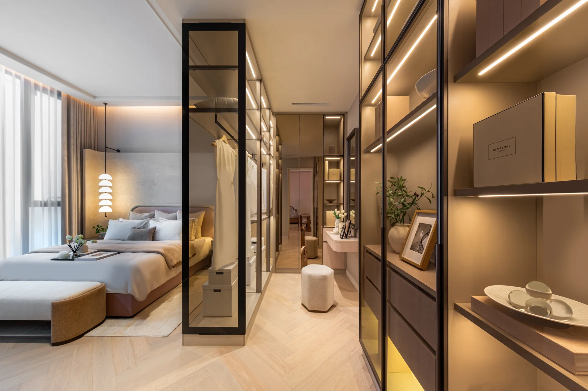 Bedroom and dressing area in a STILL Sukhumvit 20 show apartment, not a completed residence.