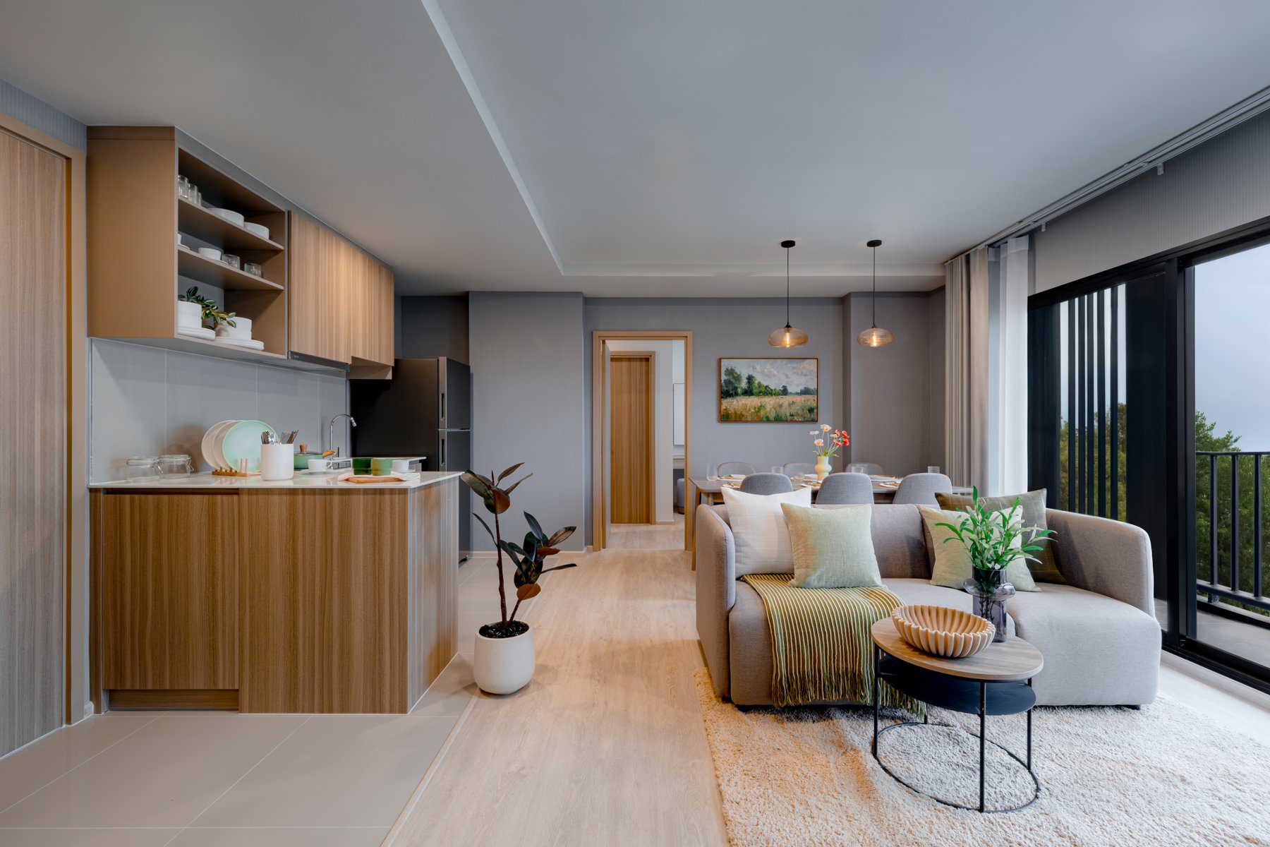 The Base Cherngtalay: Living area and kitchenette in a one-bedroom unit at The Base Cherngtalay.