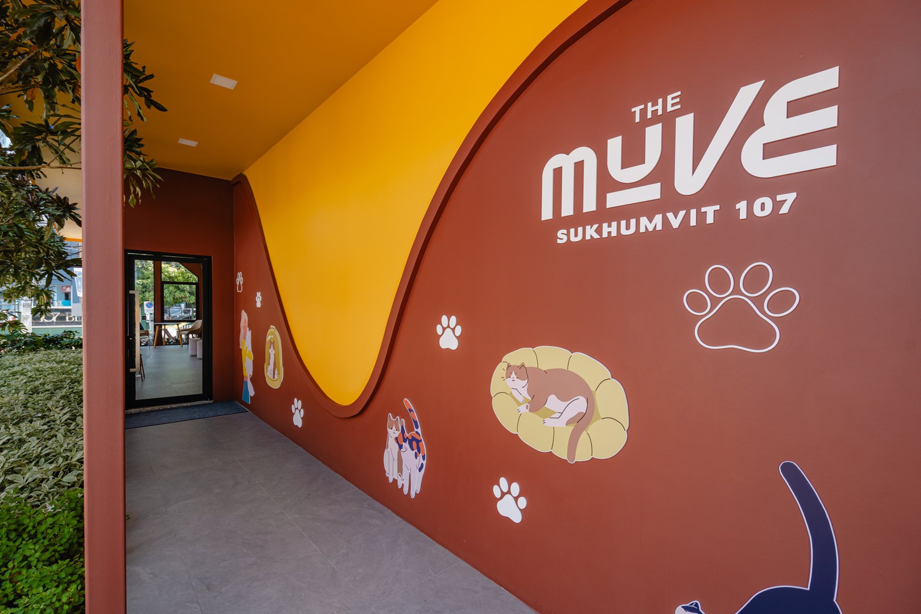The MUVE Sukhumvit 107: A decorative wall with pet-themed graphics at The MUVE Sukhumvit 107.